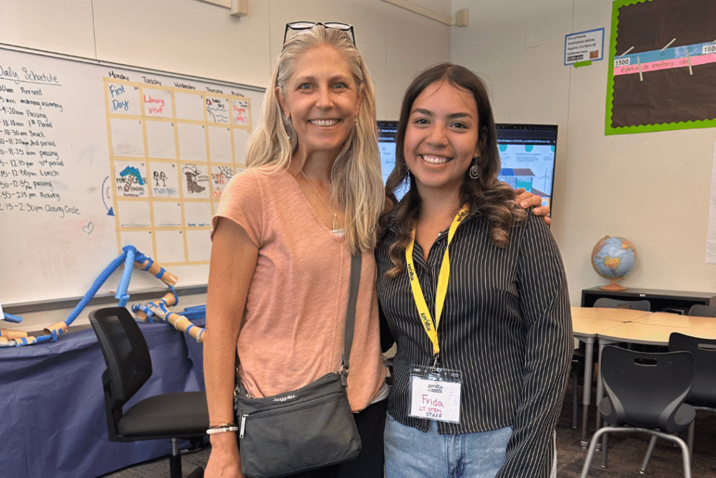 Past Excellence in Education Executive Director Laura Brown and Frida at the Aim High Open House visiting day in Kings Beach.