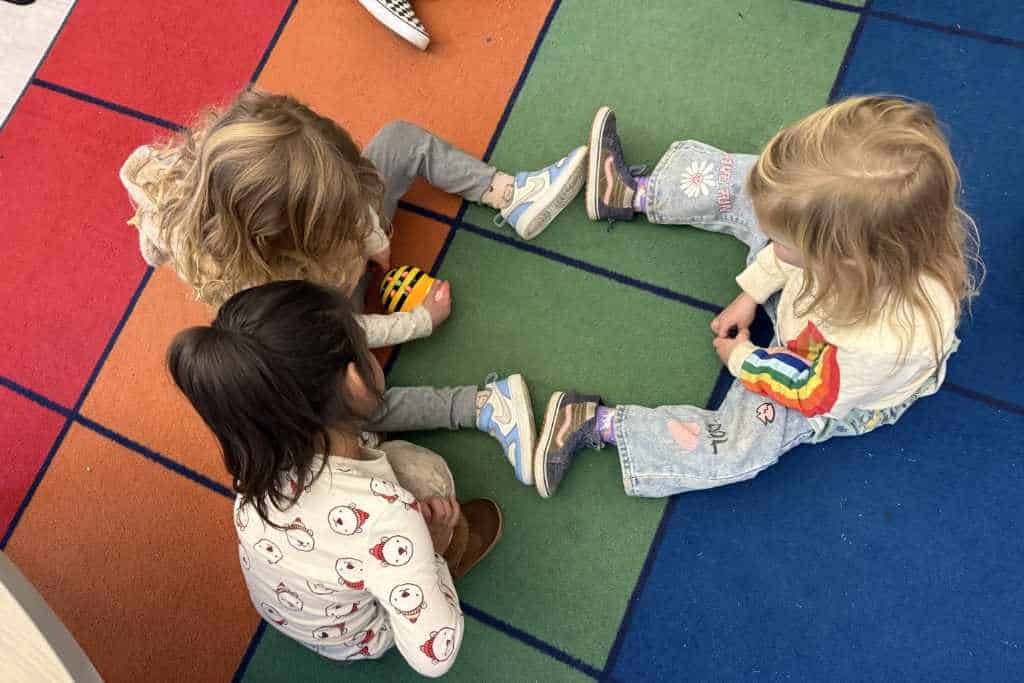 children playing together on a playmat